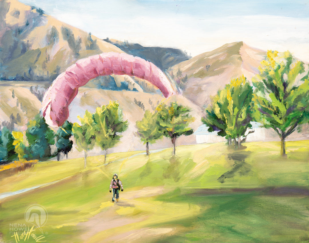 Nena Howell's "Gliding Cashmere" oil painting invites viewers to Cashmere, Washington park with a parasailer coming in for landing.